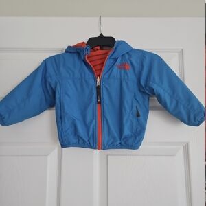 The North Face Infant Jacket in Blue with Orange Zipper